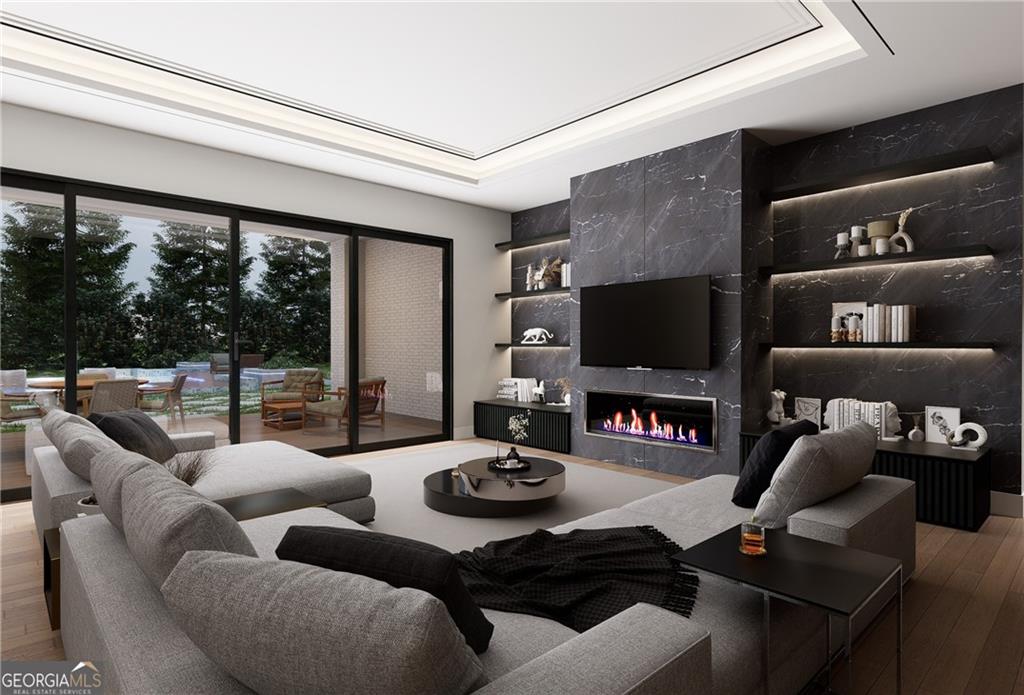 591 Decoupage Drive Fairburn, GA 30213 - Photo 30 of 34 a living room with furniture a flat screen tv and a floor to ceiling window