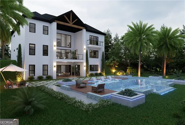 a view of a house with backyard and sitting area