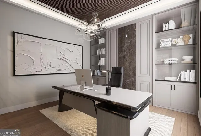 a view of a kitchen area with furniture and wooden floor