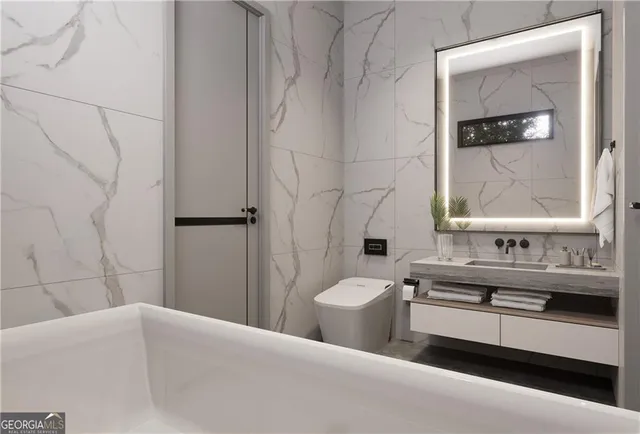 a bathroom with a double vanity sink toilet and shower