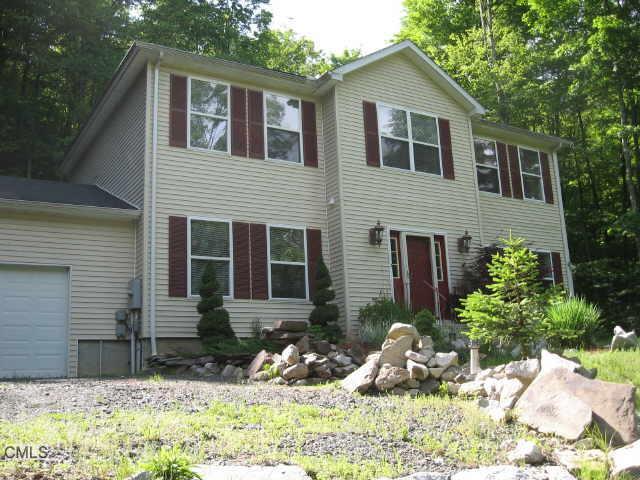 4 Hidden Brook Road New Milford, CT 06776 - Photo 1 of 1 a front view of house with yard outdoor seating and barbeque oven