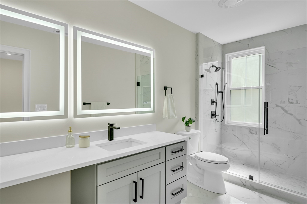 686 Centre Street Newton, MA 02458 - Photo 15 of 26 a bathroom with a sink toilet and shower