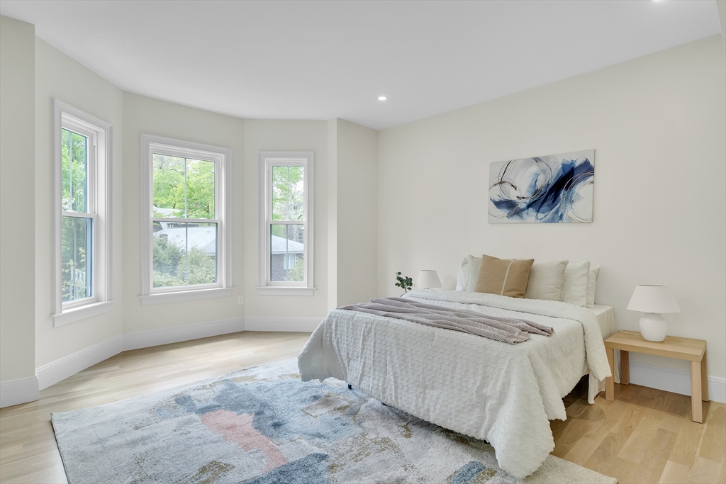 686 Centre Street Newton, MA 02458 - Photo 19 of 26 a bedroom with a large bed and a window