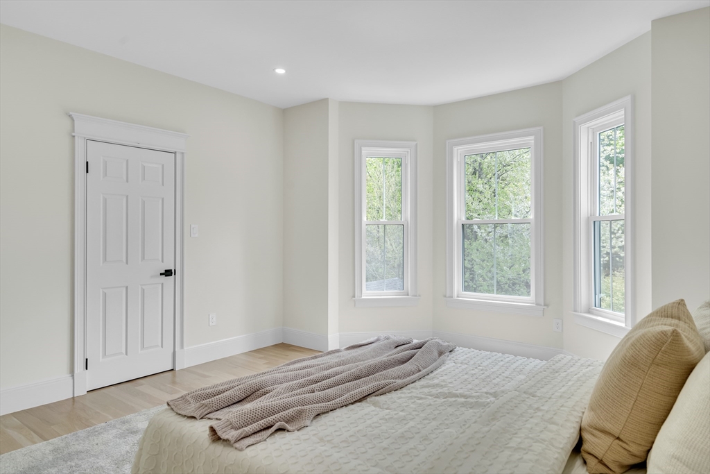 686 Centre Street Newton, MA 02458 - Photo 20 of 26 a bedroom with a bed and a window