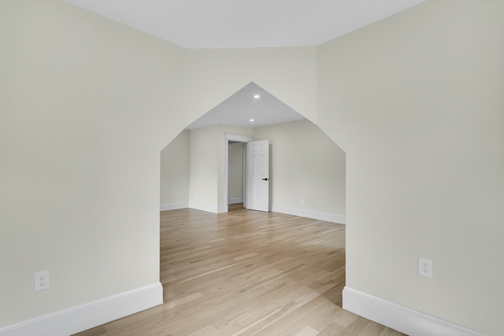 686 Centre Street Newton, MA 02458 - Photo 23 of 26 a view of an empty room with wooden floor and a window