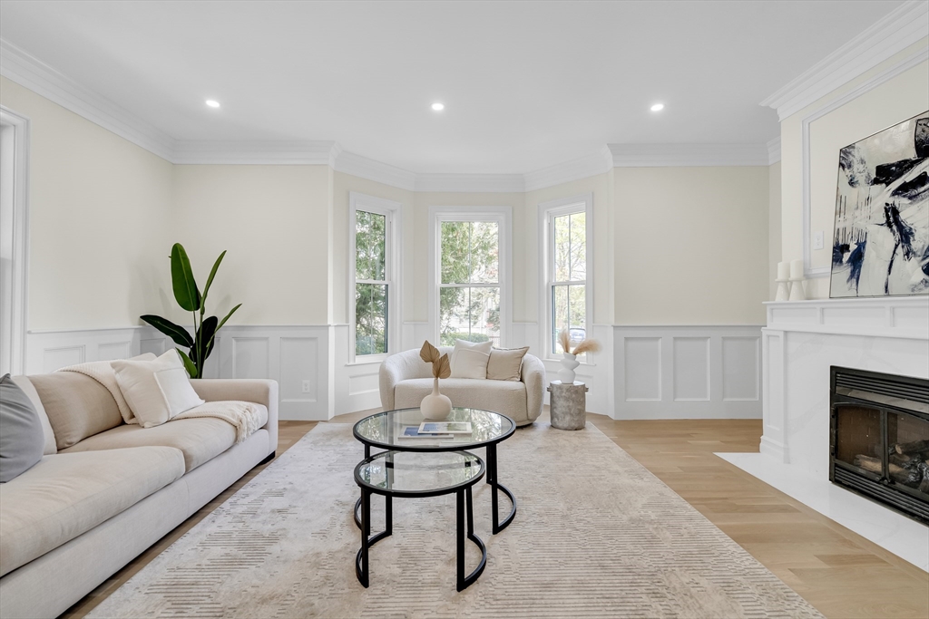 686 Centre Street Newton, MA 02458 - Photo 7 of 26 a living room with furniture and a fireplace