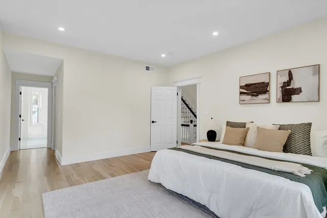 a bedroom with bed and tv