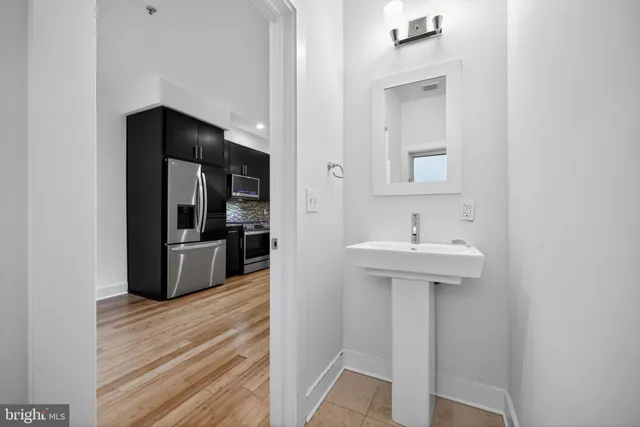 a bathroom with a sink and a mirror