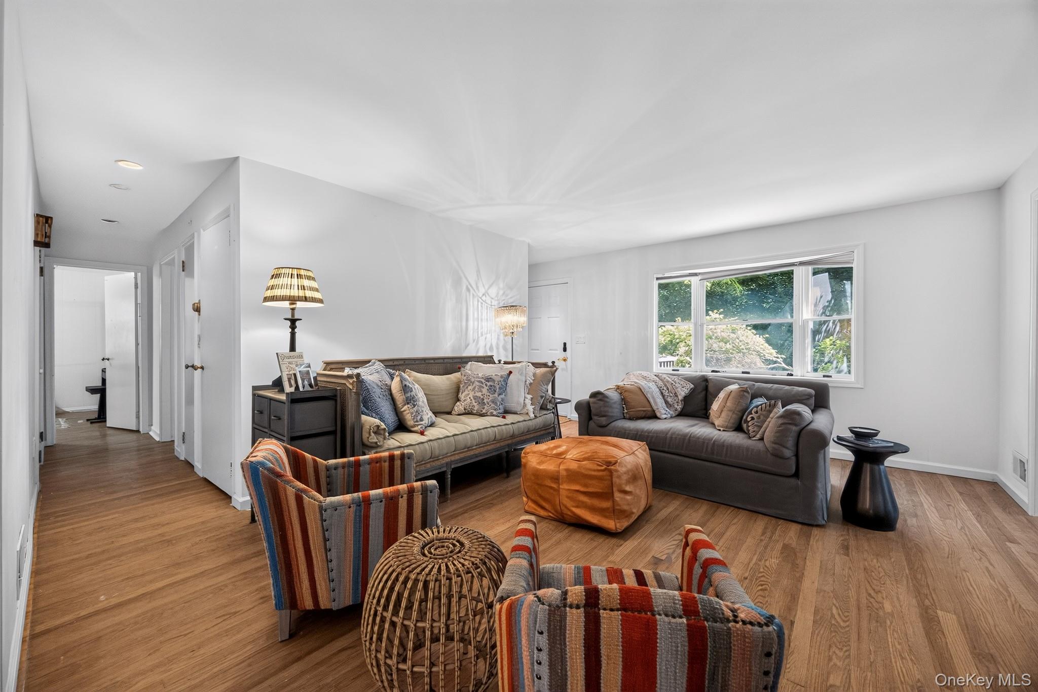 2 Terrace Road Suffern, NY 10901 - Photo 4 of 19 Wood-finish flooring throughout, white painted walls, and a large window with white trim