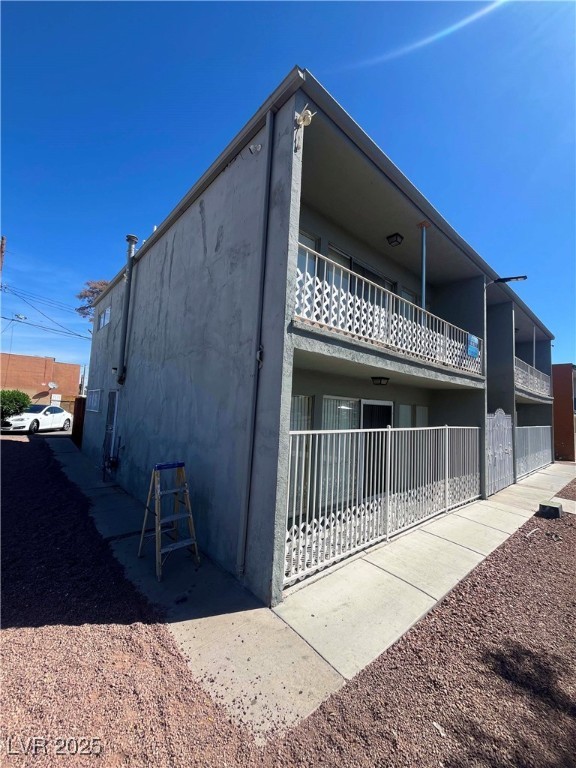 1388 East Desert Inn Road, Unit 2(ROOM A) Las Vegas, NV 89169 - Photo 12 of 13 View of side of property featuring stucco siding a