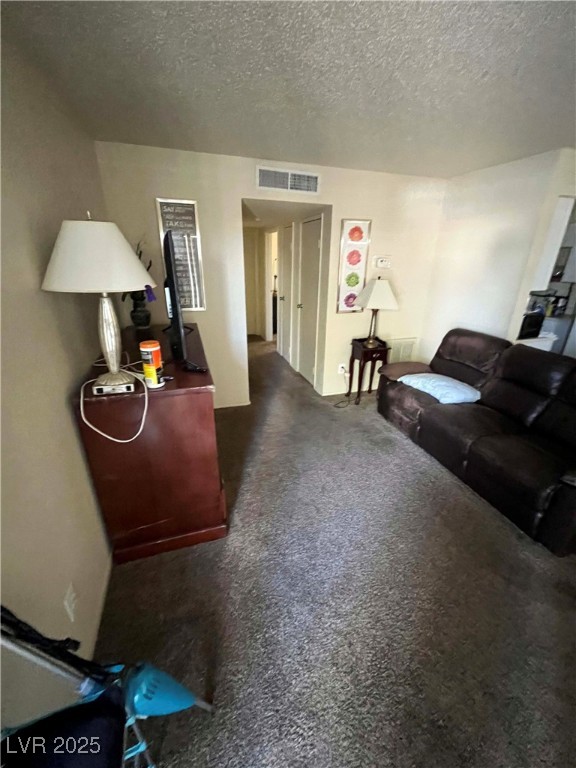 1388 East Desert Inn Road, Unit 2(ROOM A) Las Vegas, NV 89169 - Photo 5 of 13 Living area featuring a textured ceiling