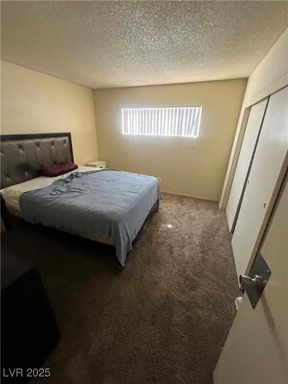 1388 East Desert Inn Road, Unit 2(ROOM A) Las Vegas, NV 89169 - Photo 6 of 13 Bedroom featuring carpet floors, a textured ceilin