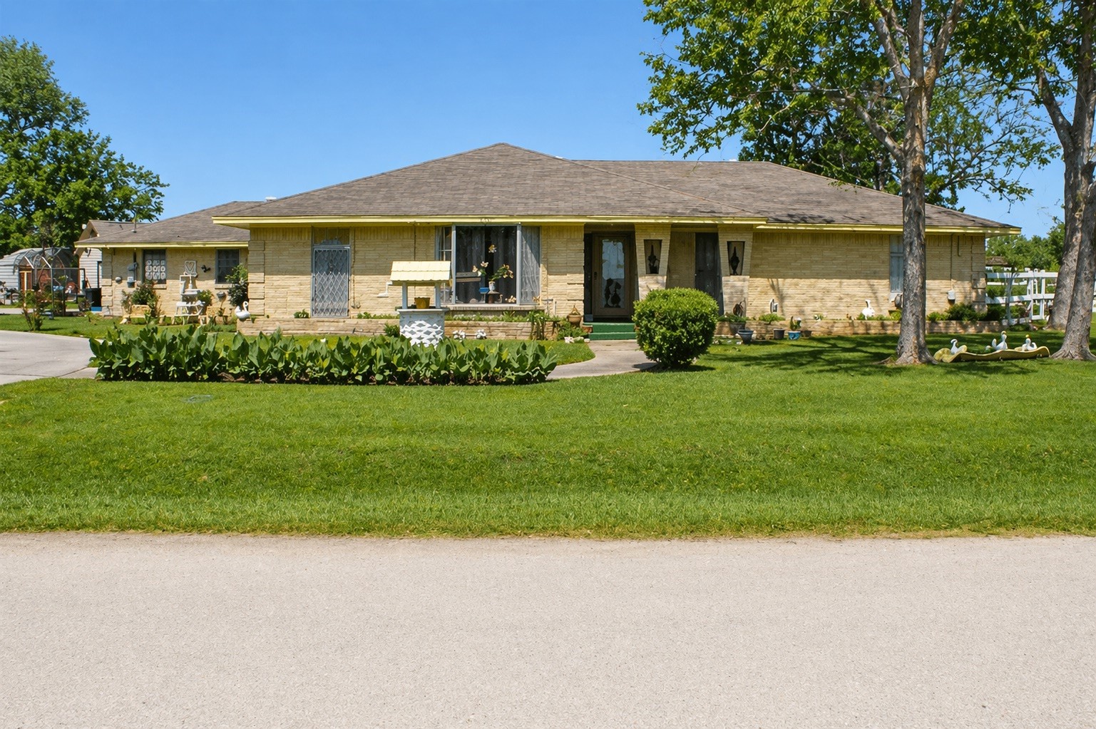 206 Riverside Street Highlands, TX 77562 - Photo 1 of 12 Classic brick traditional on over half an acre with a sprawling lush lawn, mature shade trees, and charming front landscaping, undeniable curb appeal from the moment you arrive.