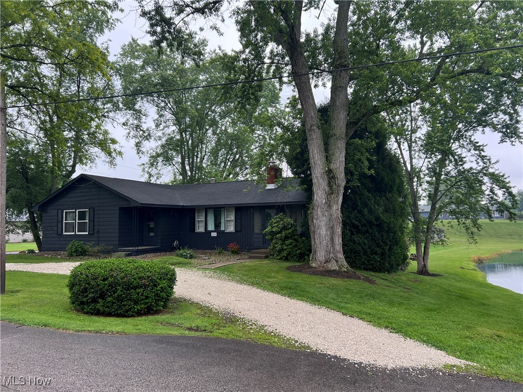 232 Hoffman Road Loudonville, OH 44842 - Photo 15 of 28 Ranch-style home with a chimney, a front lawn, and driveway