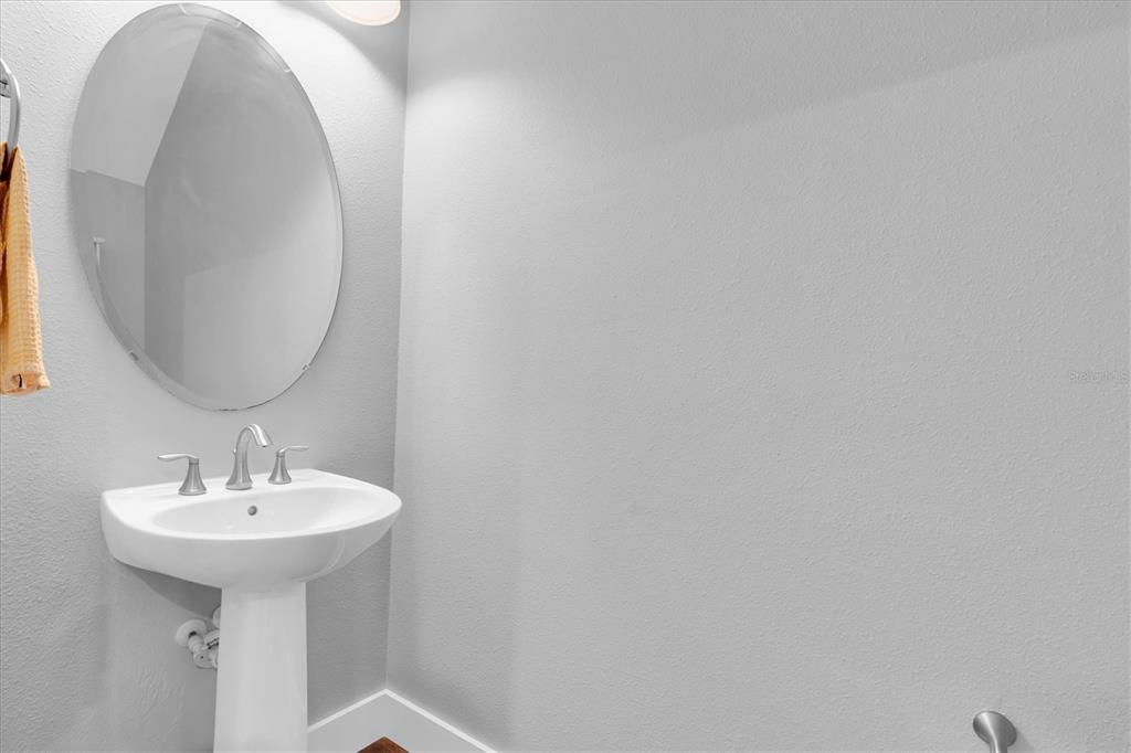 5233 Sylvester Loop Tampa, FL 33610 - Photo 12 of 36 a bathroom with a sink and a mirror
