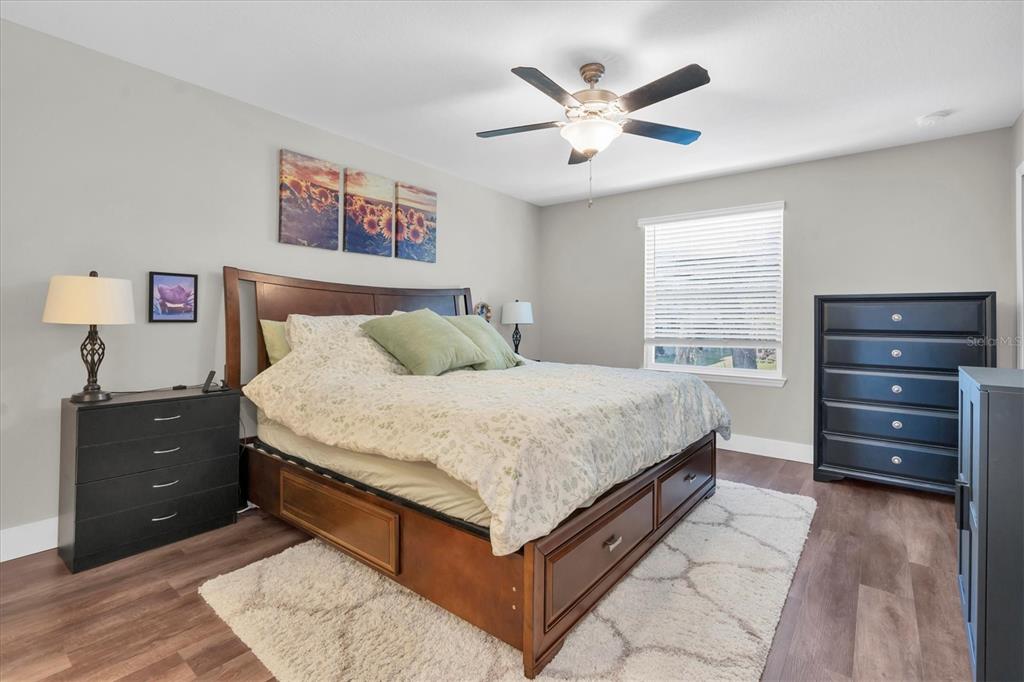 5233 Sylvester Loop Tampa, FL 33610 - Photo 15 of 36 a bedroom with a bed and a dresser
