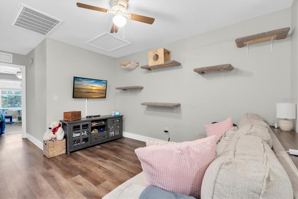 5233 Sylvester Loop Tampa, FL 33610 - Photo 20 of 36 a living room with furniture and a flat screen tv