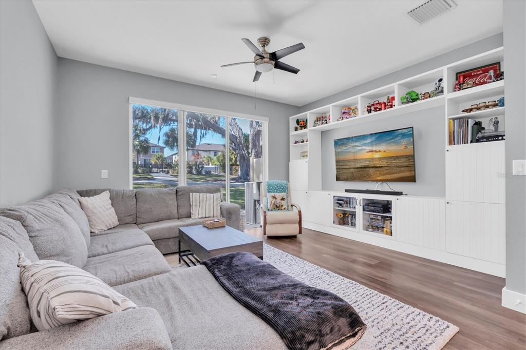 5233 Sylvester Loop Tampa, FL 33610 - Photo 5 of 36 a living room with furniture and a flat screen tv