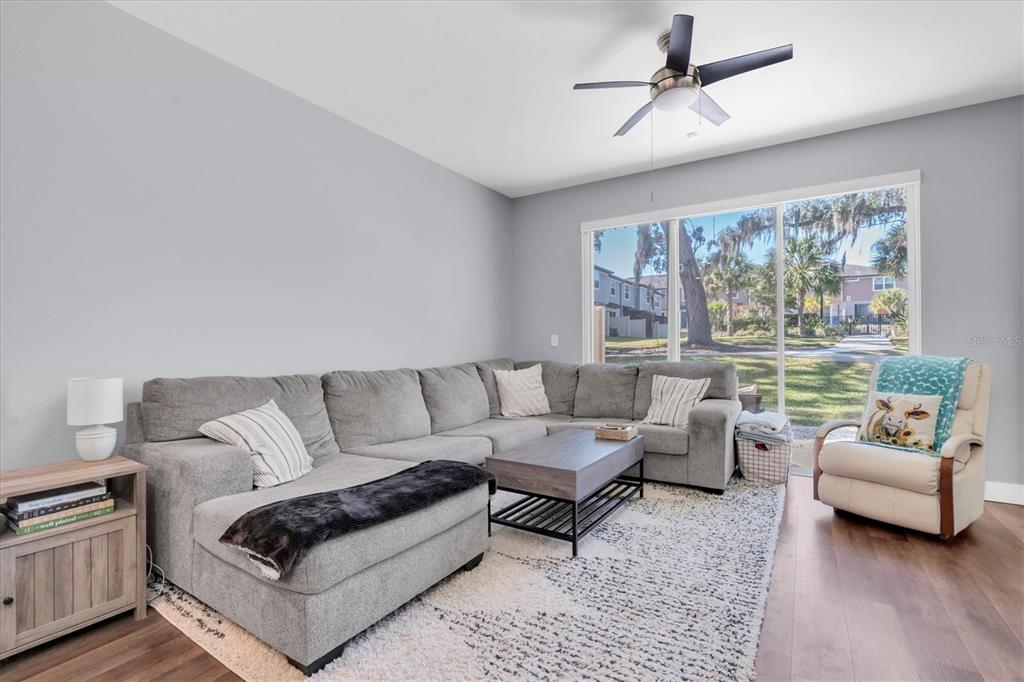 5233 Sylvester Loop Tampa, FL 33610 - Photo 6 of 36 a living room with furniture and a large window