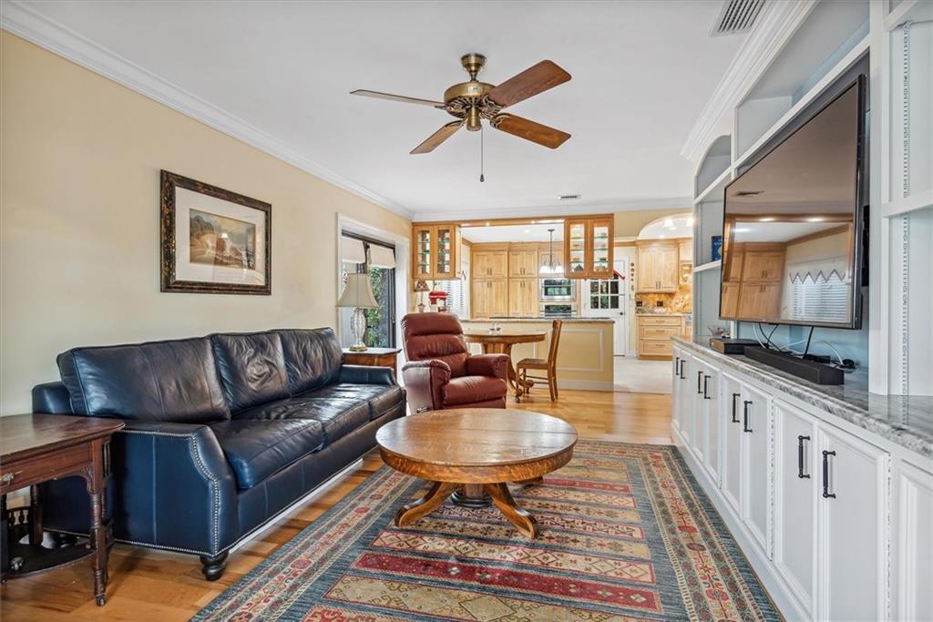 8680 Eagle Run Drive Boca Raton, FL 33434 - Photo 12 of 34 a living room with furniture and a flat screen tv