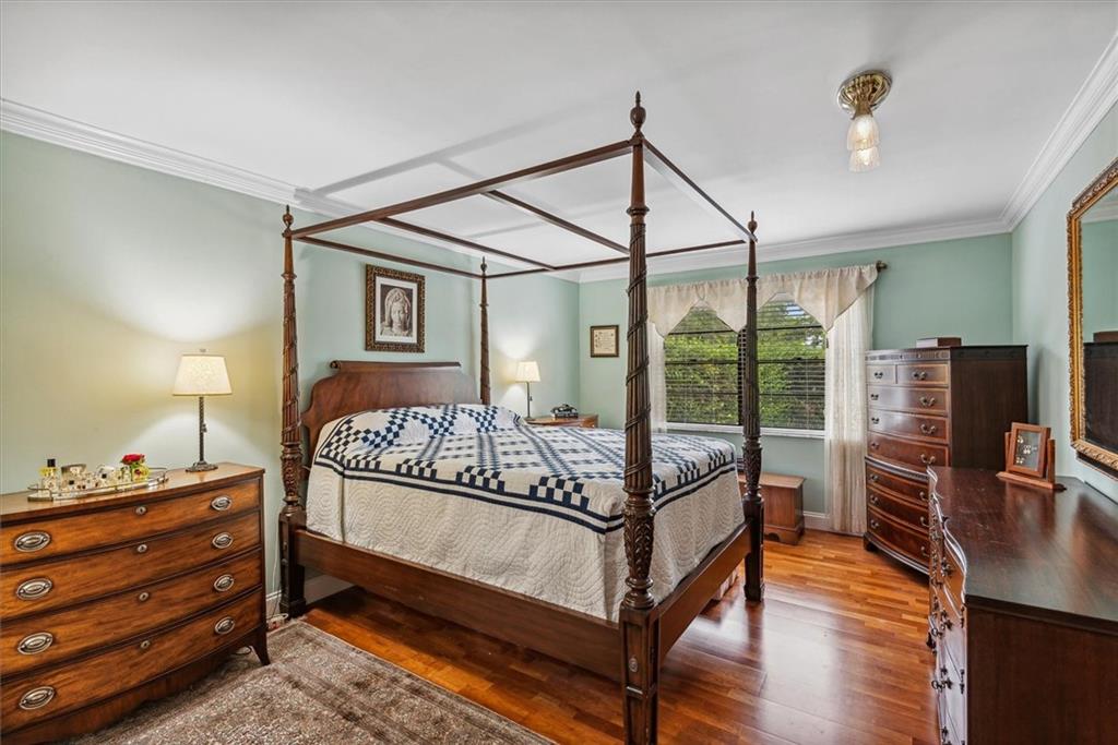 8680 Eagle Run Drive Boca Raton, FL 33434 - Photo 13 of 34 a bedroom with a bed a dresser with wooden floor