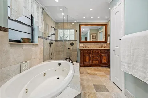 a bathroom with a bathtub and a shower