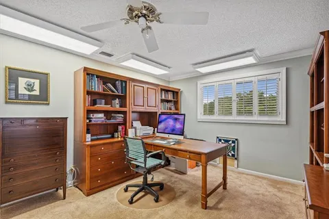 a view of a workspace with furniture