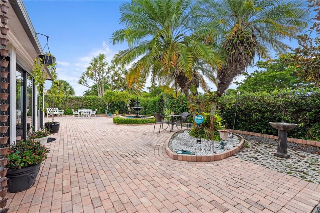 8680 Eagle Run Drive Boca Raton, FL 33434 - Photo 20 of 34 a view of a street with a fountain