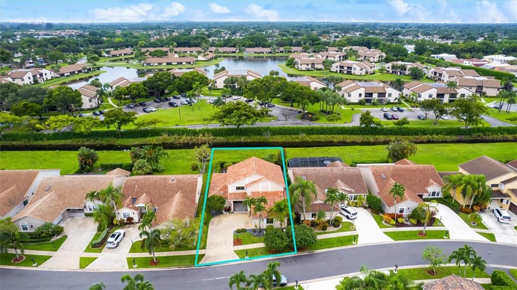 8680 Eagle Run Drive Boca Raton, FL 33434 - Photo 28 of 34 an aerial view of a house with outdoor space swimming pool ocean and green space