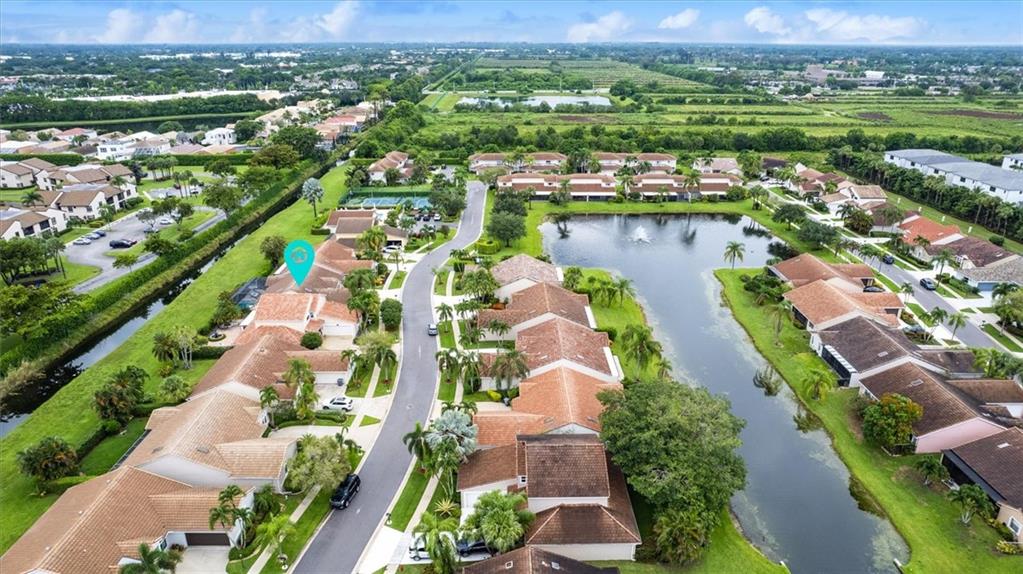 8680 Eagle Run Drive Boca Raton, FL 33434 - Photo 33 of 34 an aerial view of lake residential houses with outdoor space and lake view