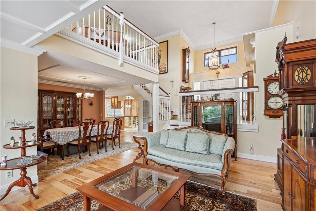 8680 Eagle Run Drive Boca Raton, FL 33434 - Photo 5 of 34 a living room with furniture a fireplace and a chandelier
