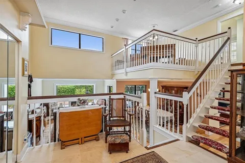 a bedroom with furniture and a window