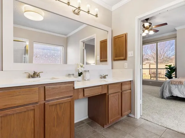 a spacious bathroom with a double vanity sink mirror and double