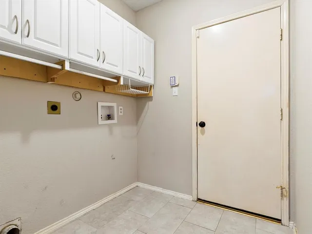 a view of a storage and utility room with washer and dryer
