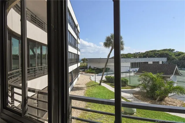 a kitchen with stainless steel appliances kitchen island granite countertop a sink and cabinets