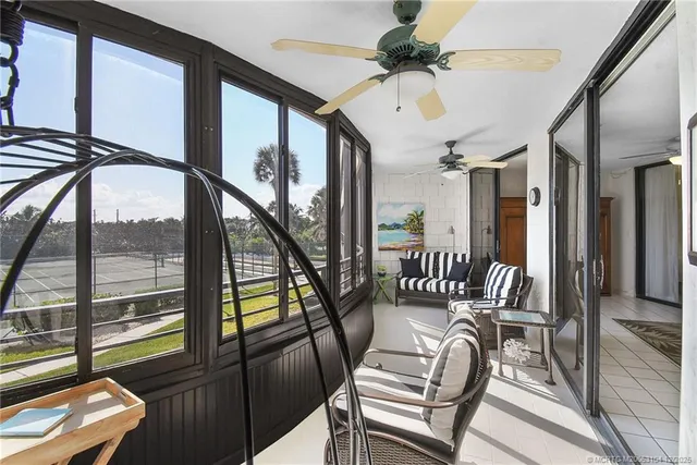 a kitchen with white cabinets sink and white appliances