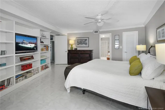 a bathroom with a granite countertop toilet sink and mirror