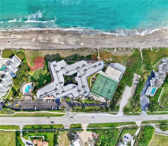 swimming pool view with a seating space