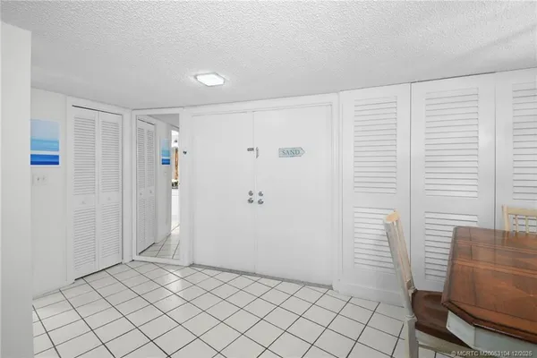 a view of balcony with chairs and wooden floor