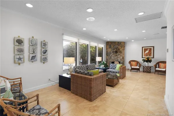 an aerial view of a house with outdoor space and swimming pool