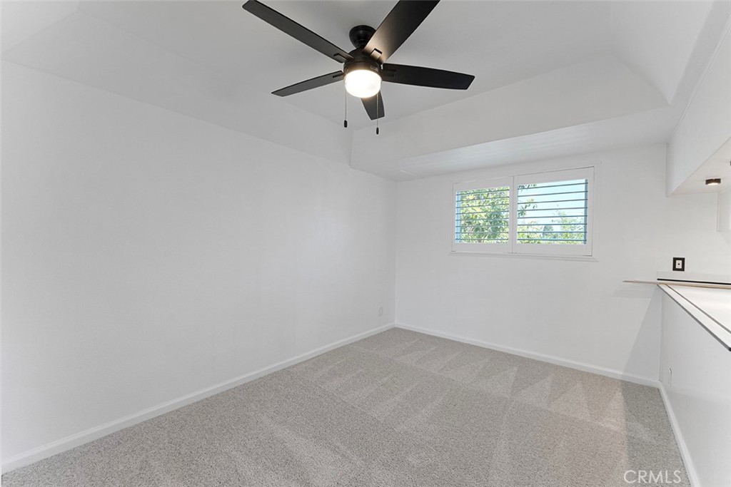 13036 Springarden Lane Westminster, CA 92683 - Photo 15 of 41 an empty room with a window and a fan