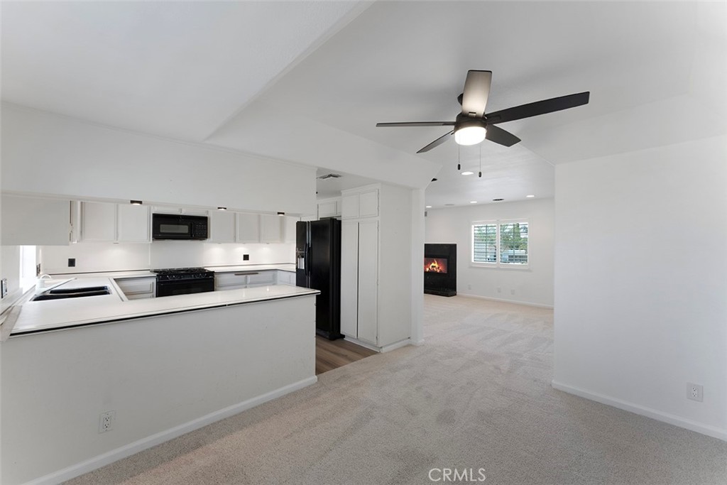 13036 Springarden Lane Westminster, CA 92683 - Photo 16 of 41 a kitchen with stainless steel appliances a sink and a refrigerator