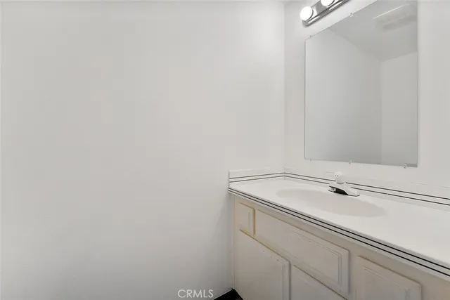 a view of a room with wooden floor and shower