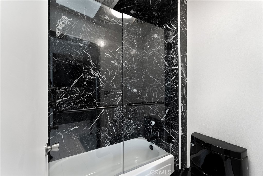 13036 Springarden Lane Westminster, CA 92683 - Photo 24 of 41 a bathroom with a bathtub