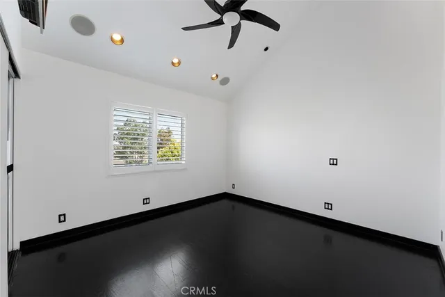 a bathroom with a sink shower and a mirror
