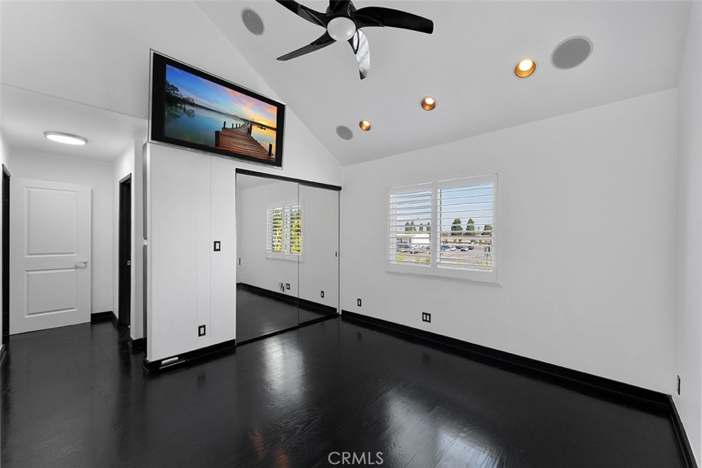 13036 Springarden Lane Westminster, CA 92683 - Photo 27 of 41 a view of a livingroom with hardwood floor and a ceiling fan
