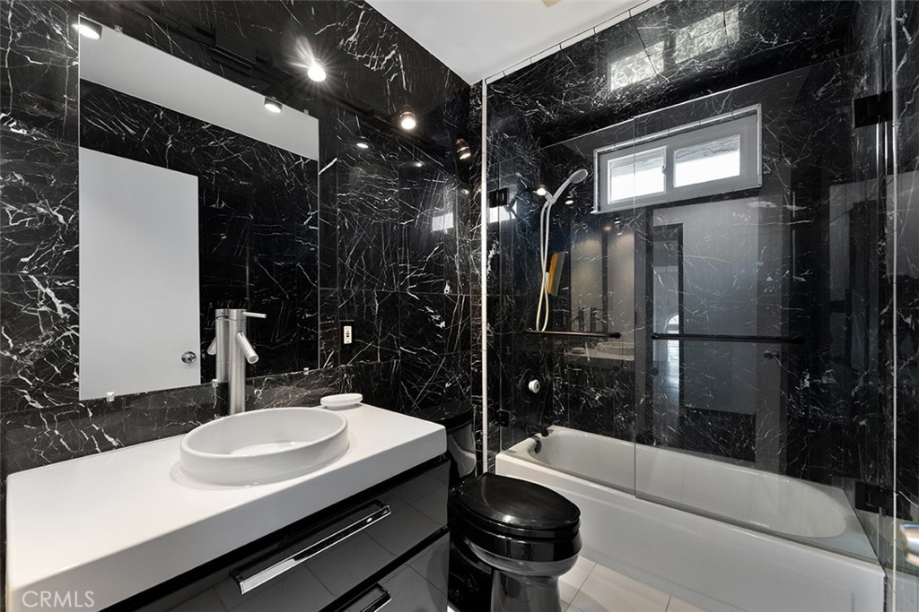 13036 Springarden Lane Westminster, CA 92683 - Photo 28 of 41 a bathroom with a sink shower and a mirror