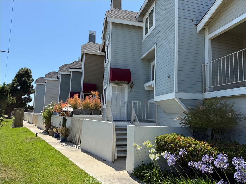 13036 Springarden Lane Westminster, CA 92683 - Photo 3 of 41 a view of a house with a potted plant ana a small yard