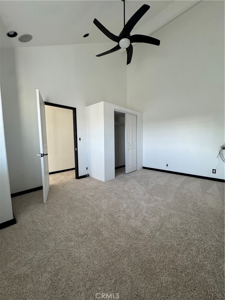 13036 Springarden Lane Westminster, CA 92683 - Photo 37 of 41 an empty room with a ceiling fan and a window