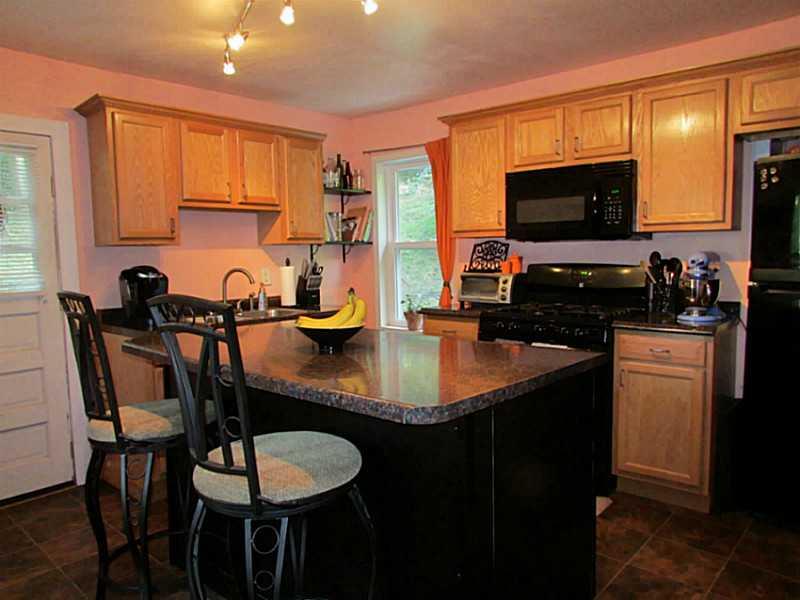 167 Poplar Street McKees Rocks, PA 15136 - Photo 3 of 22 Kitchen. Kitchen island was added in the past few years for additional food prep and area for eating and entertaining.